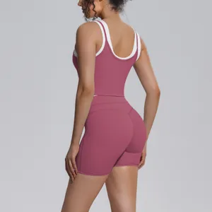 Contrast yoga set featuring a breathable pink tank top and matching shorts for fitness.