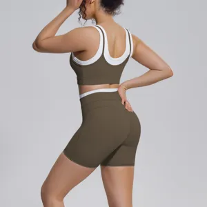 Detail view of the contrast color sports bra and biker shorts yoga set for women fitness running.