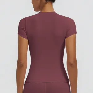 Back detail view of women quick-dry slim fit short sleeve yoga top in burgundy color.