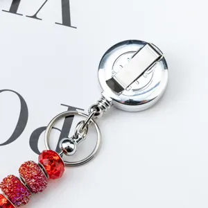 Retractable badge reel with red glitter beads, ID card holder for nurses and doctors.