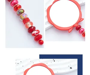 Detailed view of the red flower makeup mirror handle and decorative colorful beads.