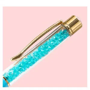 DIY kristal lege buis pen detail met blauwe strass steentjes en gouden metalen dop handgemaakt.