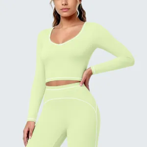 Hellgrünes langärmliges sportliches Crop-Top und Leggings Set, atmungsaktive Fitnessbekleidung.