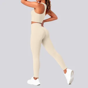 Beige seamless yoga set detail, ribbed fitness top and high waist leggings, activewear.