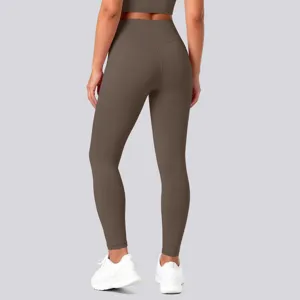 Detail view of brown high-waisted seamless yoga leggings, showing back lifting and shaping fit.