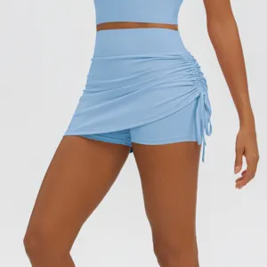 Close-up view of the light blue high-waisted ruched two-piece yoga skirt with great stretch.