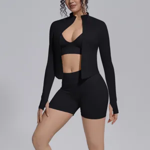 Seamless 3-piece athletic yoga set with long sleeve zip jacket sports bra and shorts for gym workout.