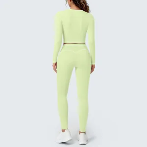 Light green long sleeve crop top and high waist yoga leggings activewear set for women workout gym.