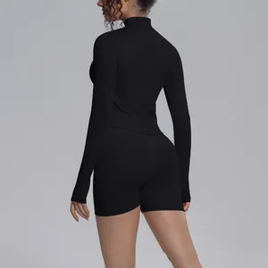Black seamless long sleeve yoga top and biker shorts activewear fitness set for women