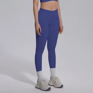 Seamless solid color high waist yoga leggings and sports bra set, breathable fitness wear.