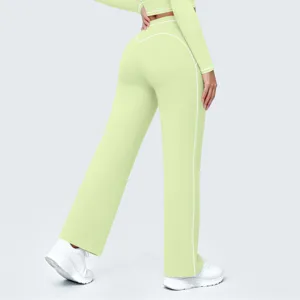 Detail view of women high waist wide leg yoga pants activewear with contrast piping design.