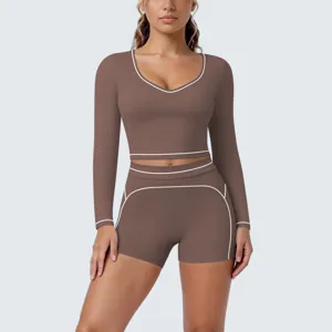 Brown long-sleeve crop top and shorts yoga set with contrast piping for fitness and running workout