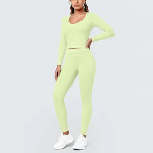 Detailed view of the light green activewear set, showing contrast piping and tight fit.