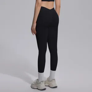 Black seamless V-waist yoga leggings back detail view, high elasticity stretchy fitness pants.