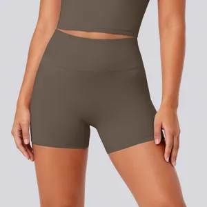 High-waisted tight yoga shorts detail showcasing soft nude fabric and comfortable fit for workout.