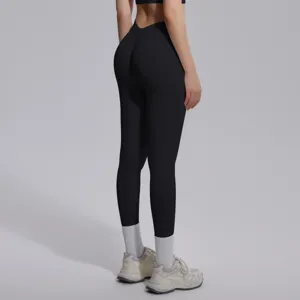 Detailed view of women's solid black high-waisted seamless fitness yoga leggings.