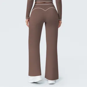 Brown high waist flare yoga pants back view detail showing contrast white piping trim design.