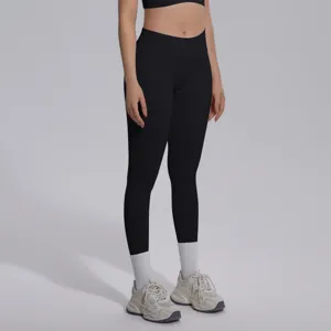 High-waisted seamless black yoga leggings detail closeup, breathable stretchy fitness pants.