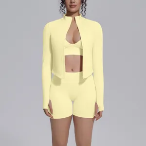 Light yellow seamless activewear detail, high elastic zip jacket, sports bra and shorts.