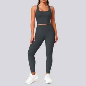 Dark grey seamless yoga set detail, athletic crop top and high waist leggings for fitness workout.
