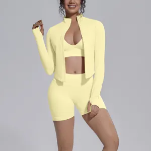 3-piece seamless sports yoga set with zip jacket, bra, and shorts in light yellow.