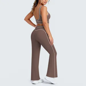 Set yoga marrone in due pezzi con bordi a contrasto vista di dettaglio fitness sportivo.