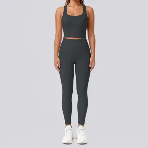 Solid dark grey athletic crop top and high-waisted leggings yoga set detail view for gym wear.
