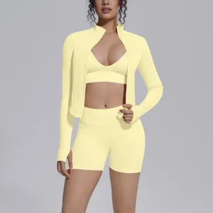 Seamless yellow activewear detail, long sleeve zip jacket and shorts three piece set view.