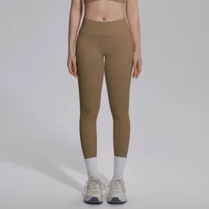 Detailed view of high-waisted solid color seamless yoga leggings, athletic wear detail shot.