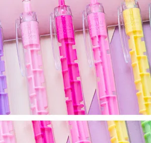 Close-up view of colorful novelty maze ballpoint pens featuring fun interactive game design.