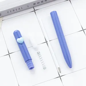 Blue twist ballpoint pen with heart decor, disassembled parts display, smooth writing office stationery.