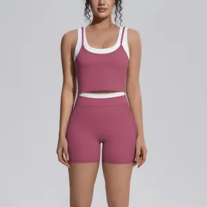 Detail view of the contrast color two-piece yoga set featuring a supportive crop top and shorts.