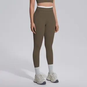 Vue détaillée du legging de fitness taille haute avec ceinture contrastée et tissu doux.