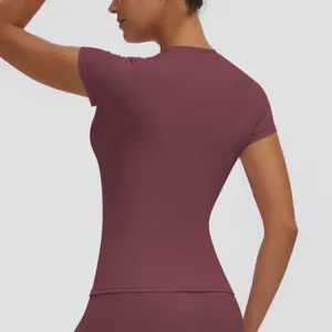 Back detail view of women slim fit short sleeve athletic top in burgundy for yoga fitness.