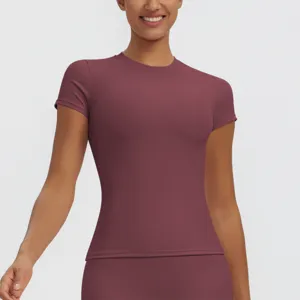 Close-up detail of women slim quick dry short sleeve sports fitness yoga top in burgundy color.