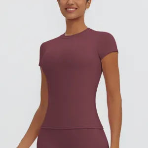Close-up view of the breathable maroon short-sleeve sports top, showing slim-fit design.