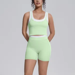 Detailed view of the color-blocking yoga suit, breathable tight workout tank top and shorts set.