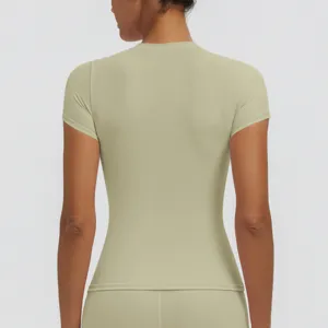 Back detail view of a sage green slim-fit short-sleeve yoga top, smooth and breathable fabric.