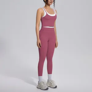 Close-up detail of the contrast layered crop top and high-waisted fitness leggings set.