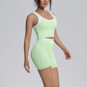 Detailed view of the women's color-blocked activewear tank top and shorts fitness set.