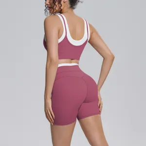 Detailed view of the pink and white contrast back design on this seamless workout activewear set.