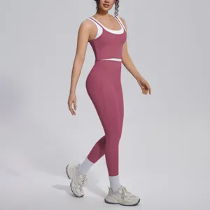 Detailed view of women pink contrast activewear set, breathable elastic fabric yoga wear.