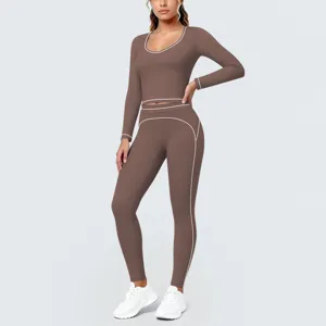 Brown long sleeve top and leggings detail featuring elegant white contrast piping trim for women.