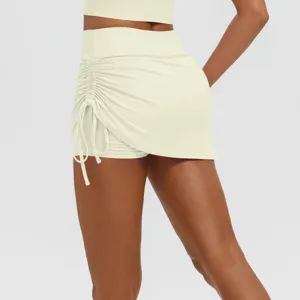 Close-up view of side ruched high waist athletic skirt detail for yoga workout sessions.