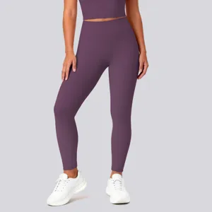 Detail view of high-waisted seamless yoga leggings in solid purple for sports and fitness.