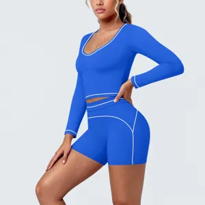 Blue long sleeve crop top and shorts activewear set with white contrast piping for fitness yoga.
