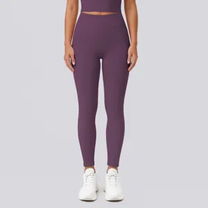Close-up of high waist and butt lifting design on stretchy solid purple yoga fitness leggings.