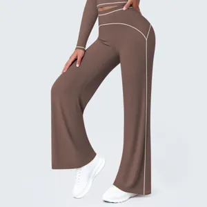 Close-up detail of high-waisted wide-leg yoga pants with contrast piping design.
