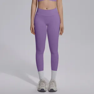 Detail view of high-waisted seamless purple yoga leggings, smooth stretchy fitness apparel.