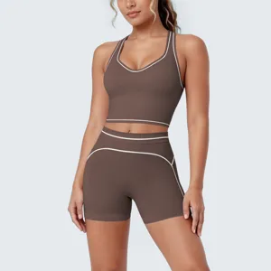 Brown athletic yoga set with contrast piping, racerback bra and shorts for gym workout fitness.